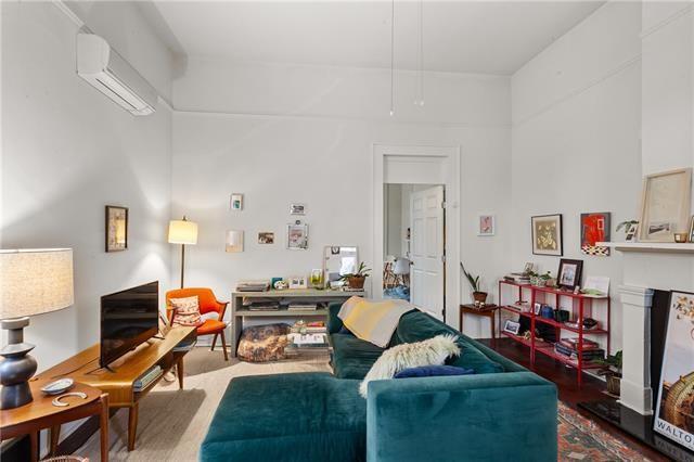living area featuring a wall mounted air conditioner