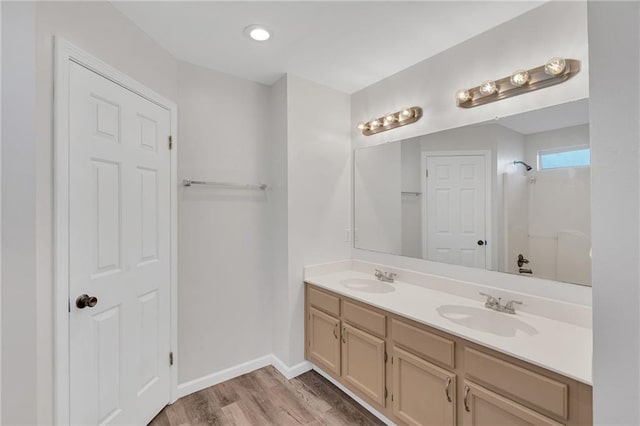 bathroom with wood-type flooring and vanity