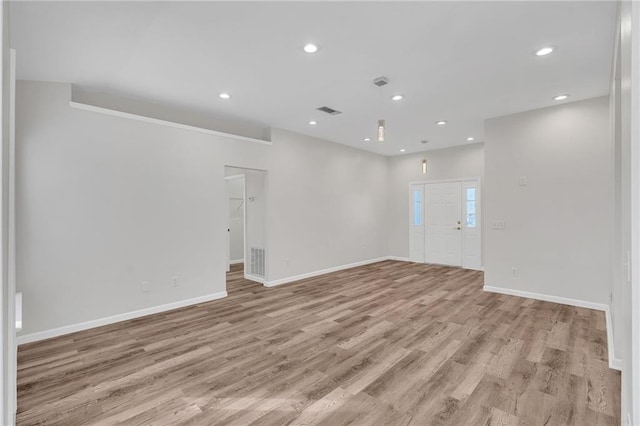 spare room featuring light wood-type flooring