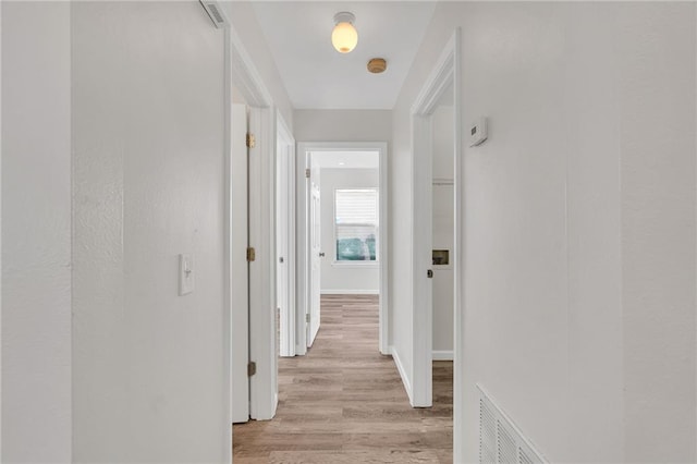 corridor featuring light wood-type flooring