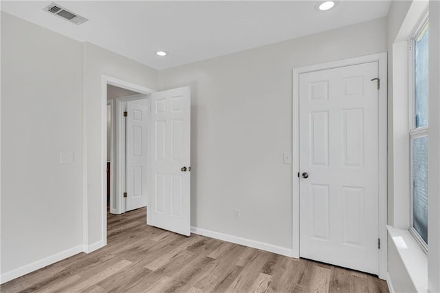 unfurnished bedroom featuring light hardwood / wood-style floors