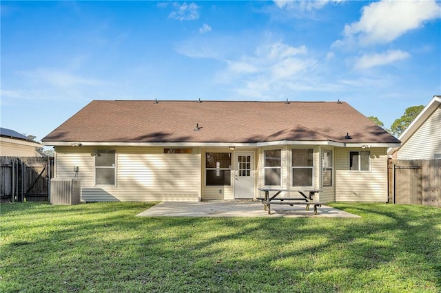 back of house with a yard, a patio, and central AC