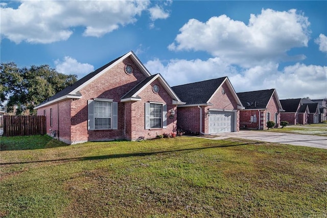 view of front of home with a garage and a front lawn