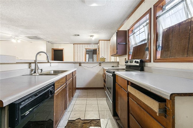 kitchen with kitchen peninsula, a textured ceiling, stainless steel electric stove, sink, and black dishwasher