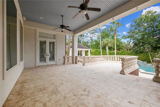 view of patio featuring ceiling fan and french doors