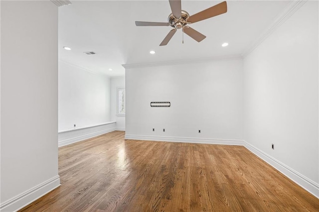 unfurnished room featuring ceiling fan, hardwood / wood-style flooring, and crown molding