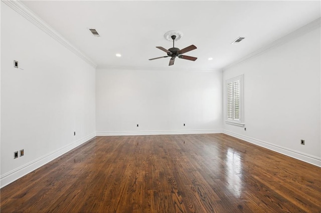 empty room with ceiling fan, crown molding, and dark hardwood / wood-style floors