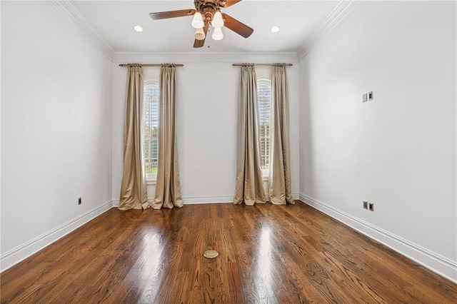 spare room with ceiling fan, crown molding, and dark wood-type flooring