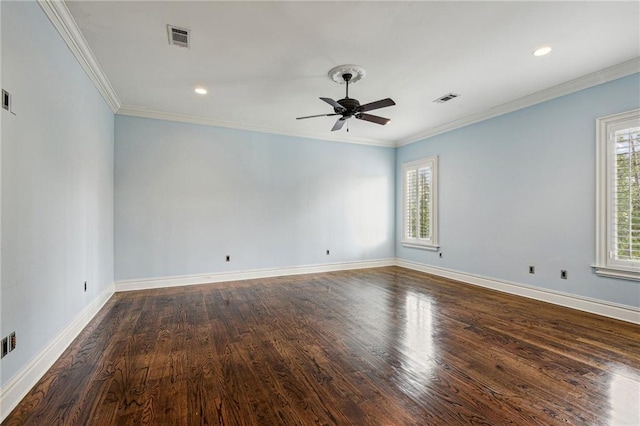 spare room featuring ceiling fan, dark wood-type flooring, and crown molding