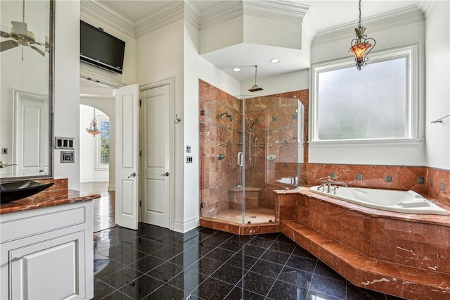 bathroom with shower with separate bathtub, vanity, ceiling fan, and plenty of natural light