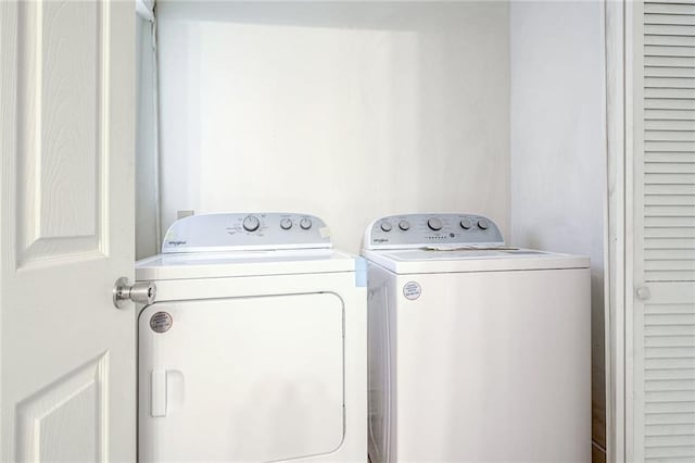 laundry room featuring separate washer and dryer