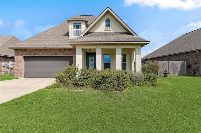 view of front of property with a front lawn and a garage