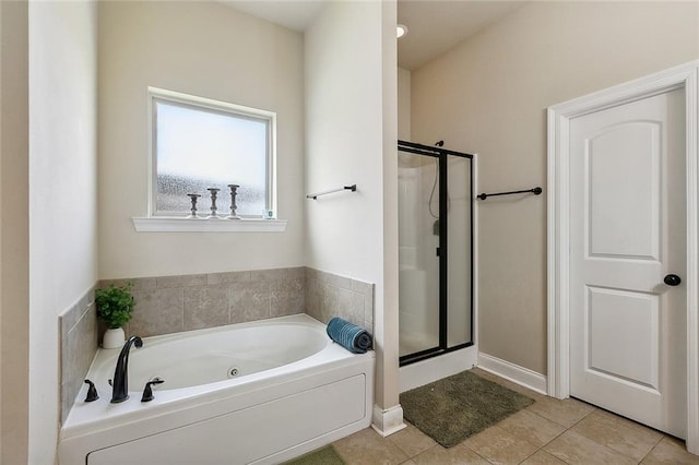 bathroom with tile patterned floors and plus walk in shower