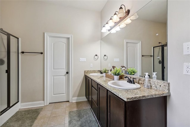 bathroom featuring vanity, tile patterned floors, and a shower with door