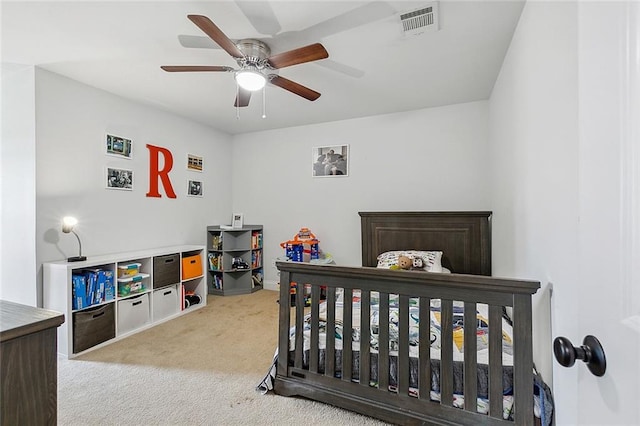 bedroom featuring ceiling fan and carpet floors