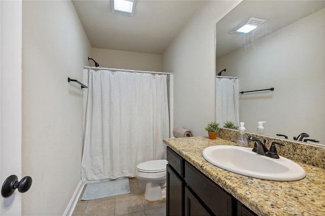 bathroom featuring tile patterned floors, vanity, a shower with shower curtain, and toilet