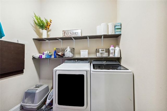 laundry area with washing machine and dryer