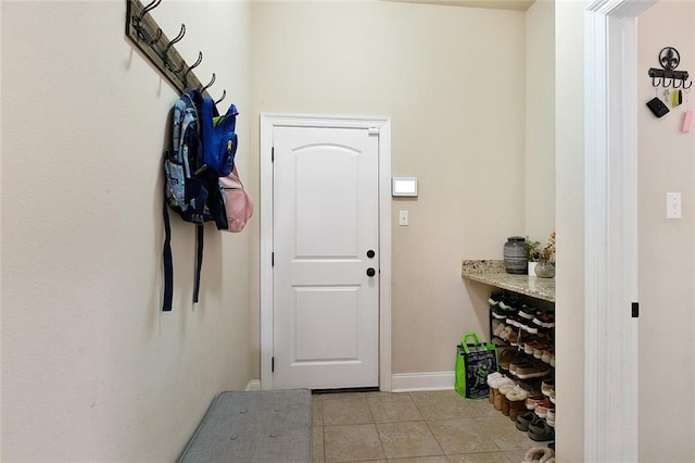 mudroom with light tile patterned floors