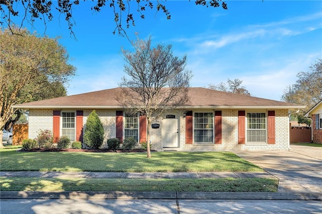 single story home with a front yard