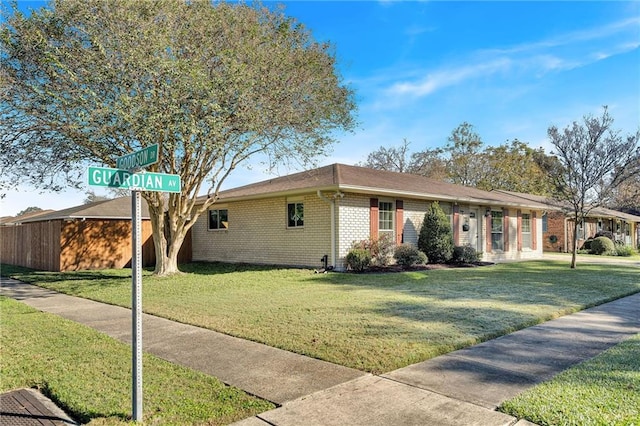 single story home with a front lawn