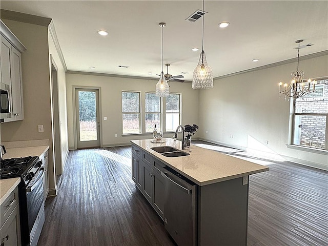 kitchen with gray cabinets, sink, an island with sink, and appliances with stainless steel finishes