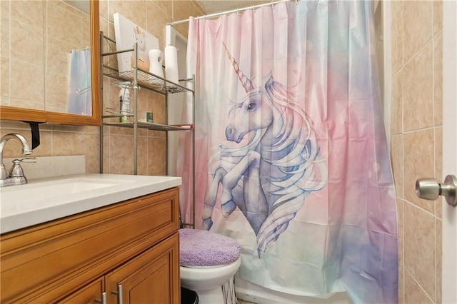 bathroom with tasteful backsplash, tile walls, vanity, toilet, and a shower with curtain