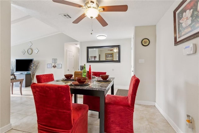 dining room with ceiling fan and light tile patterned flooring