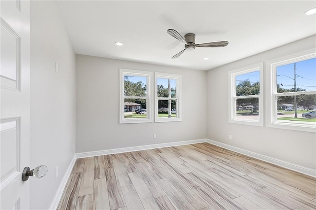 unfurnished room featuring ceiling fan and light hardwood / wood-style flooring