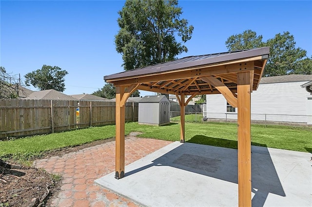 view of patio with a gazebo and a shed