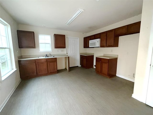 kitchen featuring sink and light wood-type flooring