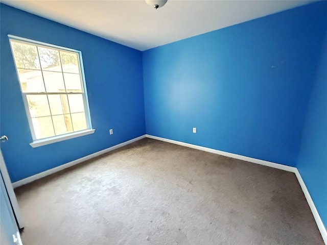 unfurnished room with carpet floors