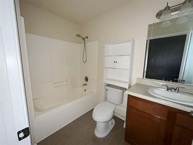 full bathroom featuring shower / tub combination, vanity, toilet, and hardwood / wood-style floors