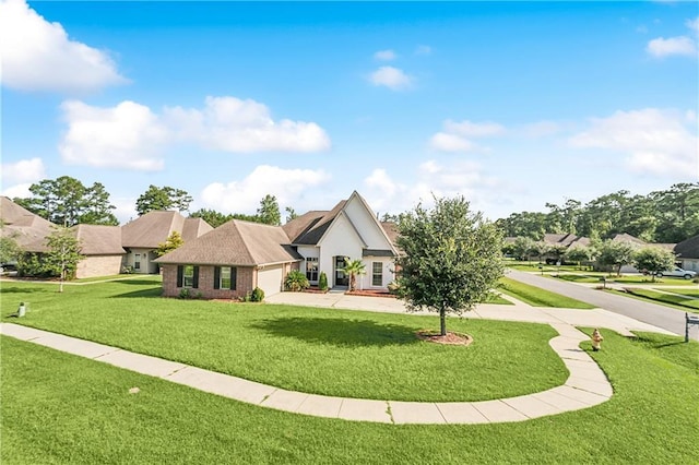 view of front of home with a garage and a front lawn