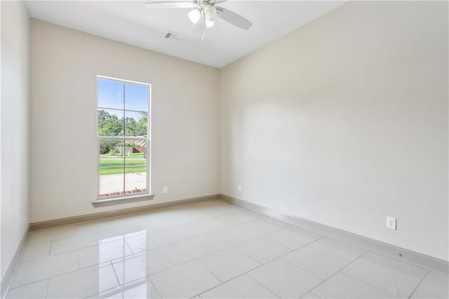 unfurnished room featuring ceiling fan and light tile patterned flooring