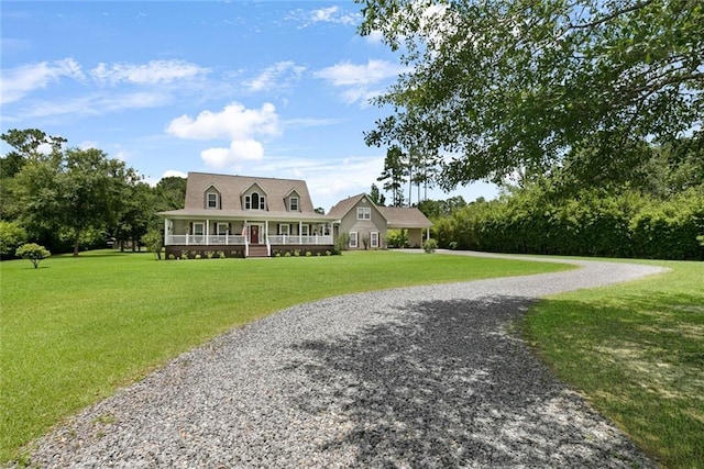 view of front of home with covered porch and a front yard