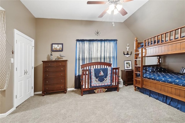 carpeted bedroom featuring ceiling fan and lofted ceiling