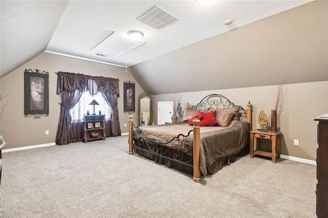 carpeted bedroom with lofted ceiling