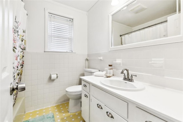 bathroom with ornamental molding, toilet, vanity, tile walls, and a shower with shower curtain