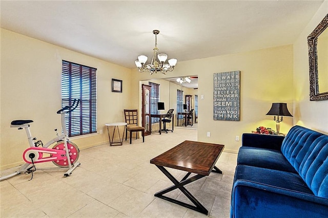 living room featuring tile patterned floors and a notable chandelier