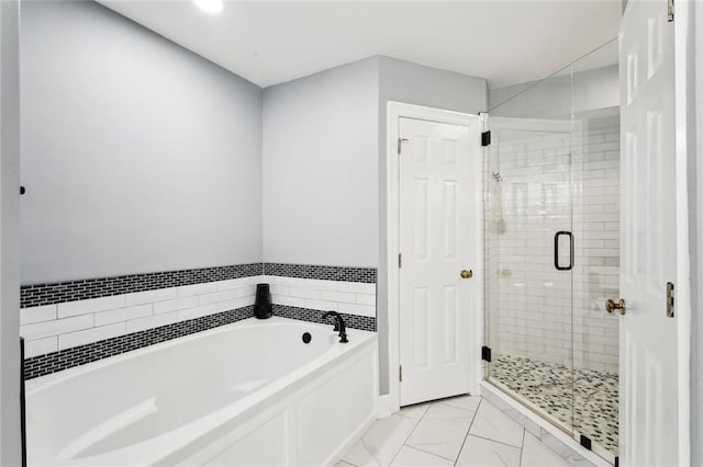 bathroom with separate shower and tub