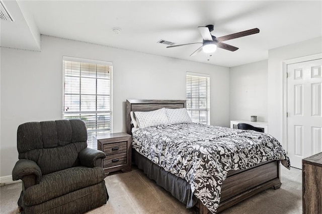 bedroom with ceiling fan and carpet