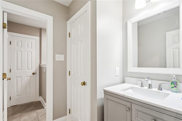 bathroom with tile patterned flooring and vanity