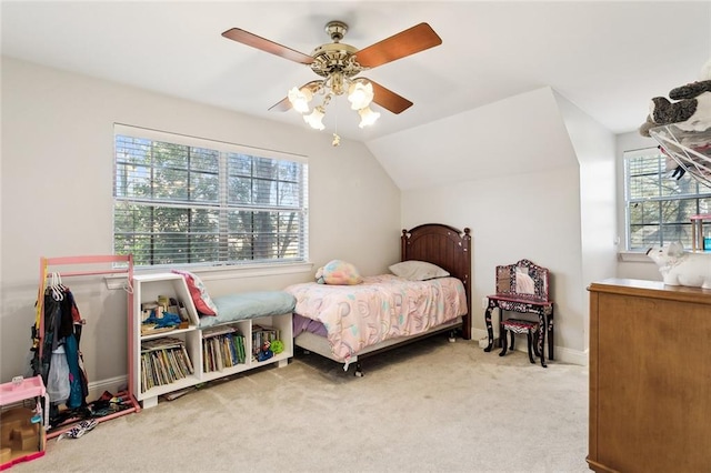 bedroom featuring ceiling fan, light carpet, and vaulted ceiling