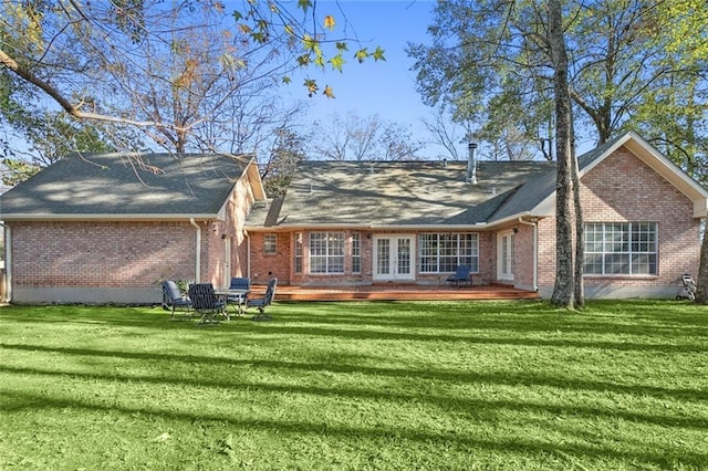 back of house with french doors, a yard, and a wooden deck