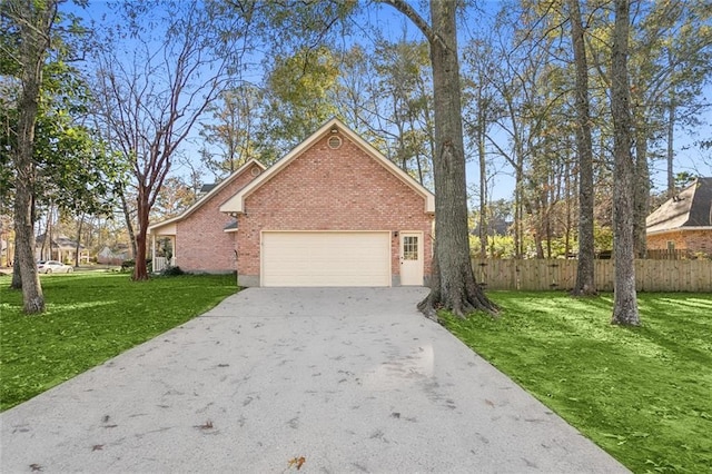 view of side of home with a yard and a garage