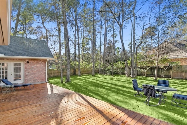 wooden deck with a lawn