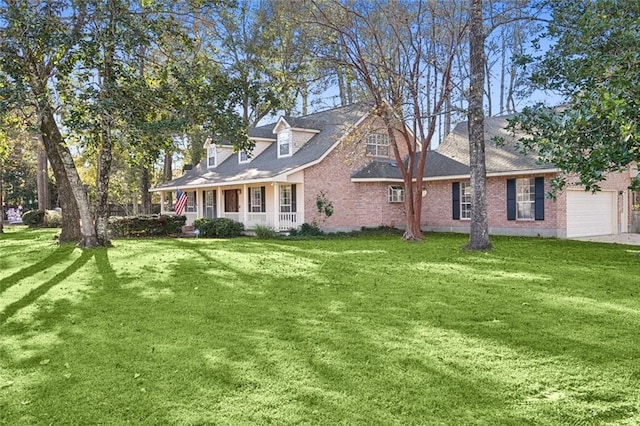 exterior space featuring a porch, a garage, and a lawn