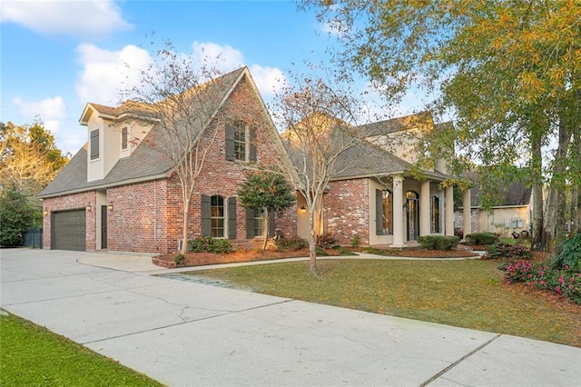 view of front of home with a garage and a front yard