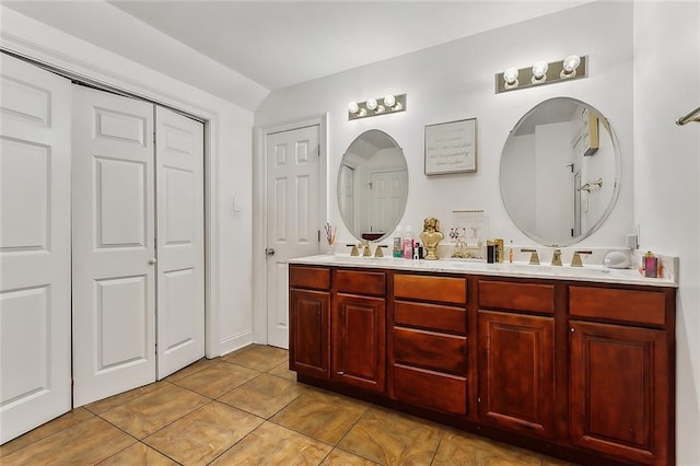 bathroom with tile patterned flooring and vanity