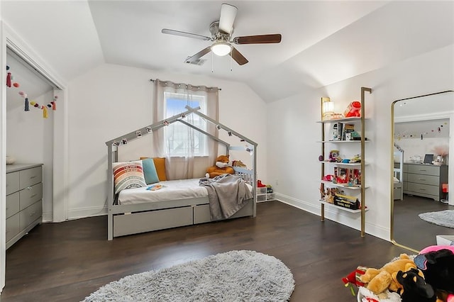 bedroom featuring ceiling fan, dark hardwood / wood-style floors, and lofted ceiling